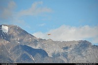 This plane appears tiny and insignificant flying past the breathtaking granite sprires of the Wrangell Mountains. For more webgalleries: www.alaska-editions.nl