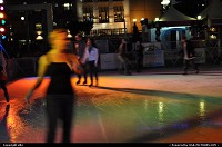 ice rink, at san francisco during christmas time, kind of wife beater shirt, wear by this woman ...well california