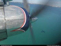 , Not in a City, FL, HISTORICAL FLIGHT FOUNDATION DC-7 N836D wearing her original 1958 color scheme. Flight out of Opa Locka on January 15 2011 Our shadow on the ocean