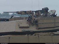 M1A2 Abrams and a focused marine.