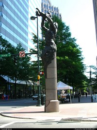 In the very hart of Charlotte, 4 bronze statues are facing each others. This is Future