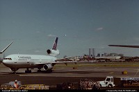 Scene from Newark Liberty International Airport. Something we will never see again there, the twin towers are gone and Continental Airlines also ceased to operate DC-10s in 2003... If you look at the left bottom of the picture you will see the Empire State Building, which is hopefully still there today !
