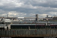 New York : I was in a position where I could see the Brooklyn Bridge that was under repairs and below was a helicopter pad in New York City,NY.
