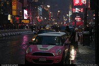 New York : A Mini Cooper (Limo version) in Times Square by night and under the snow. Miss Sixteen anyone?