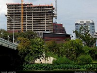 W Hotel & Residences under construction. When completed, its base will house Austin City Limits, the longest-running music series in American television history. In the foreground is Austin City Hall. The bridge at left is the South First Street Bridge