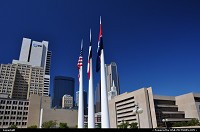 A close up to the skyline and the 3 flags (Dallas, Texas, USA) from Civic Center plaza.