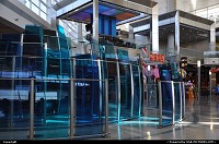 A sculpture around gate 11-14 cluster in Dallas FortWorth (DFW) distinctive terminal. The concourse is flooded by light, is very well designed and appointed to suit every visitor needs. Awaiting my next flight ...