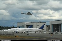 Size matters! A Cessna 177RG performing looping touch and go in Paine Field, with 2 Boeing Dreamlifter at it left and Air Force One (not visible here) close to the runway threshold. 