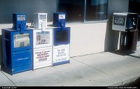 Not in a city : Somewhere along road 41 from Milwaukee to Oshkosh, a quartet of newspapers vending machines illustrates another well known and excluisve fixture in North America's landscape. Seen on left, three local newspapers came for lining-up to better standup versus isolated but nationwide sold USA Today